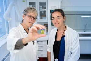 Women in lab looking at test