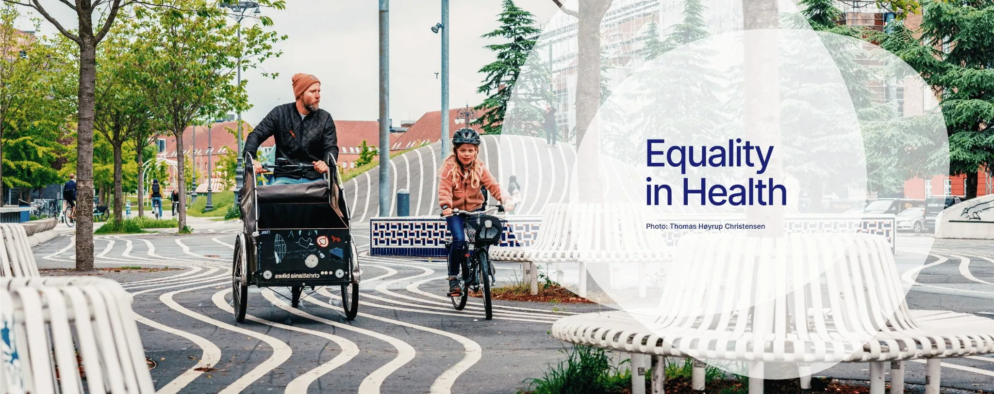 Equality in health - Man and child on bike